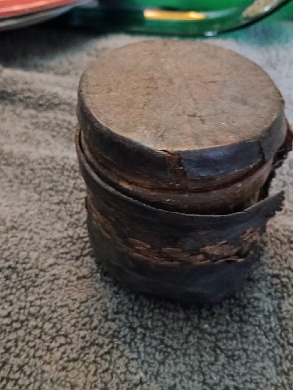 vintage or rustic Indian iron grain measuring pot, often referred to as a "Paili